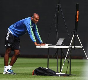 Ravi Ramineni, a sports science data analyst with SoundersFC, works at a station on the practice field as he collects data during a team training session on Wednesday, July 22, 2015, in Tukwila, Wash.  MLS SOCCER - SOUNDERS FC TRAINING REGIMEN - STARFIRE SPORTS COMPLEX, TUKWILA - 148753 - 072215